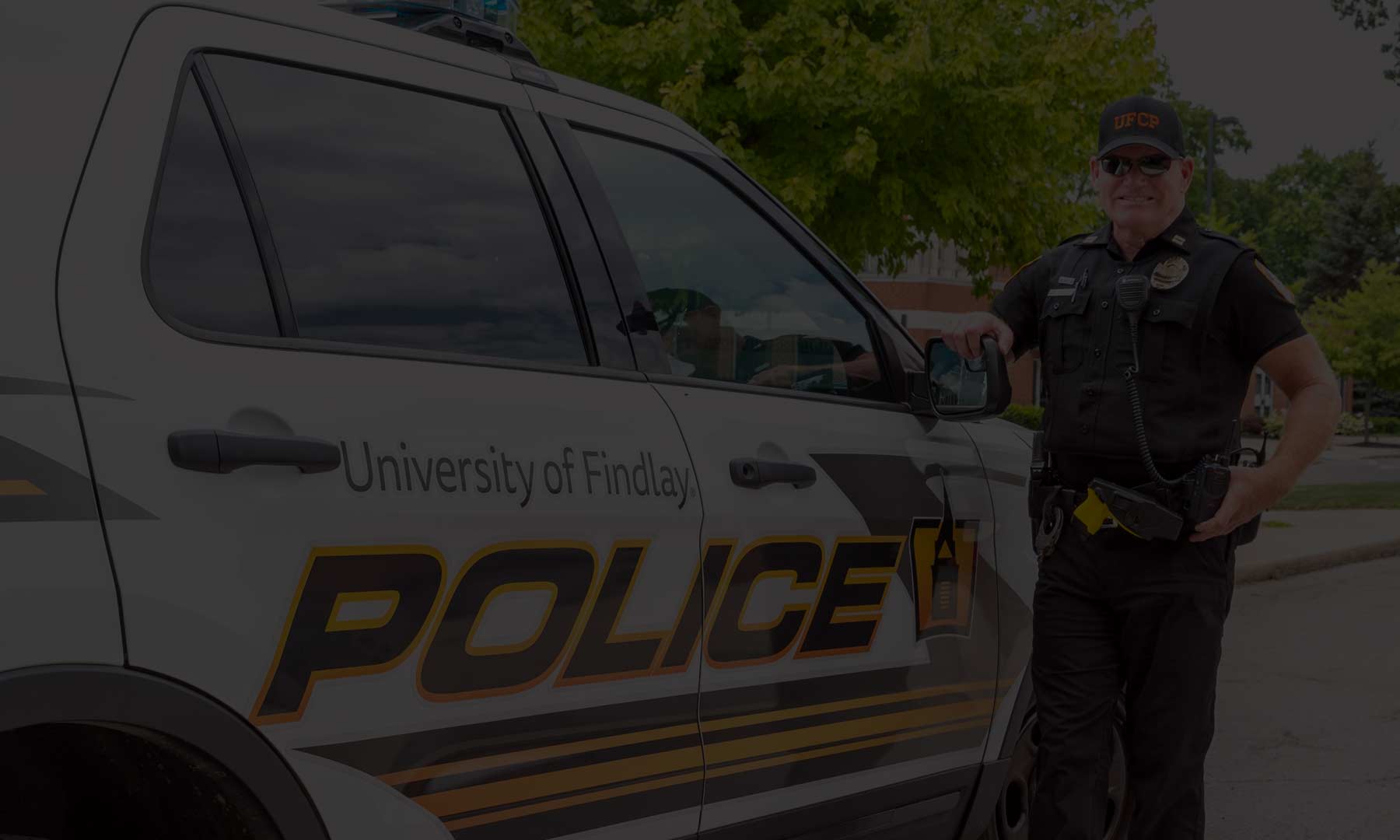 University of Findlay campus police car with police officer