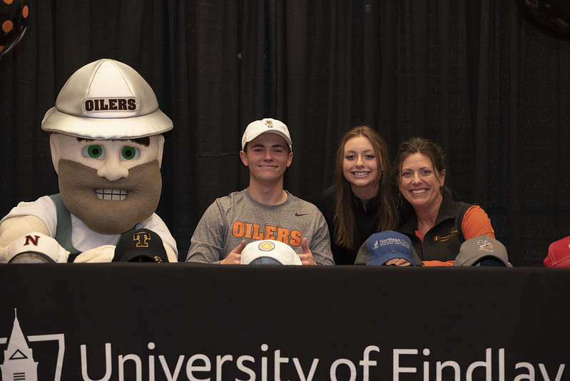 Pharmacy students with derrick the mascot and the dean of the college of pharmacy